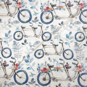 پارچه تریکو طرح دوچرخه و گلبرگ آبی یکرو نخ پنبه