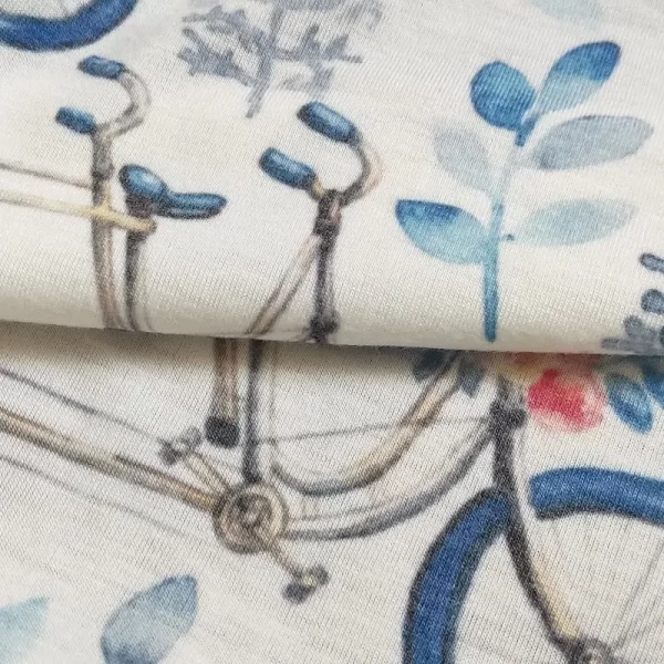 پارچه تریکو طرح دوچرخه و گلبرگ آبی یکرو نخ پنبه
