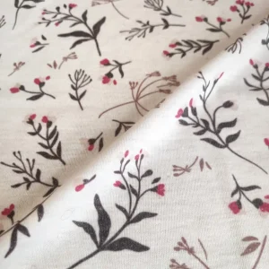 پارچه تریکو گلدار زمینه صورتی ملایم کد ۳۹۹۱۰۳۹