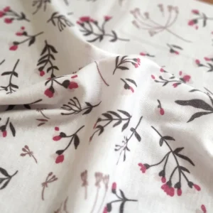 پارچه تریکو گلدار زمینه صورتی ملایم کد ۳۹۹۱۰۳۹