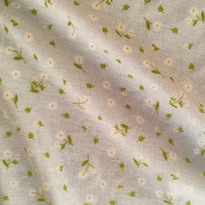 پارچه تریکو طرح گل ریز زمینه آبی روشن