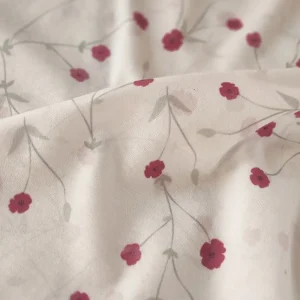 پارچه تریکو گلدار با گل های ریز صورتی کد ۴۰۴۱۰۴۶