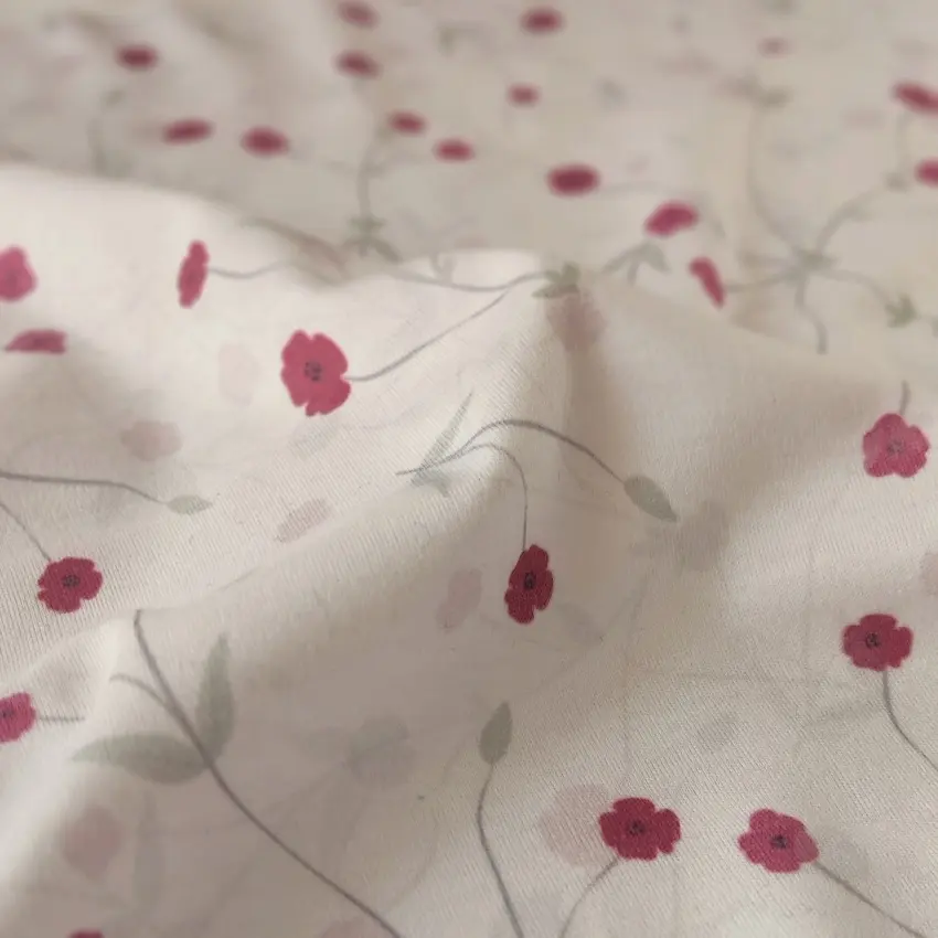 پارچه تریکو گلدار با گل های ریز صورتی کد 4041046