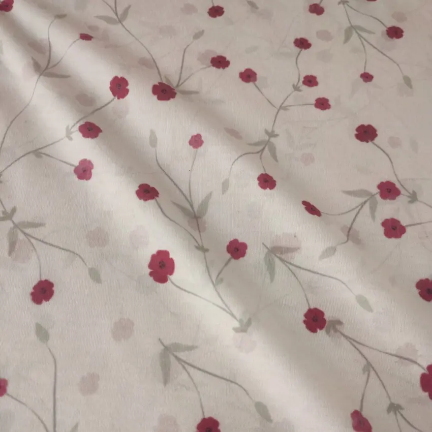 پارچه تریکو گلدار با گل های ریز صورتی کد 4041046